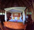sani_lodge_Suite_Cabin_with_a_king_bed.jpg